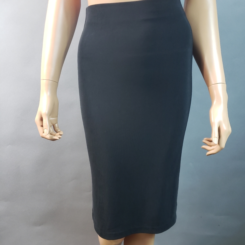 Bebe just below knee Small black skirt.  5" hem slit on both sides